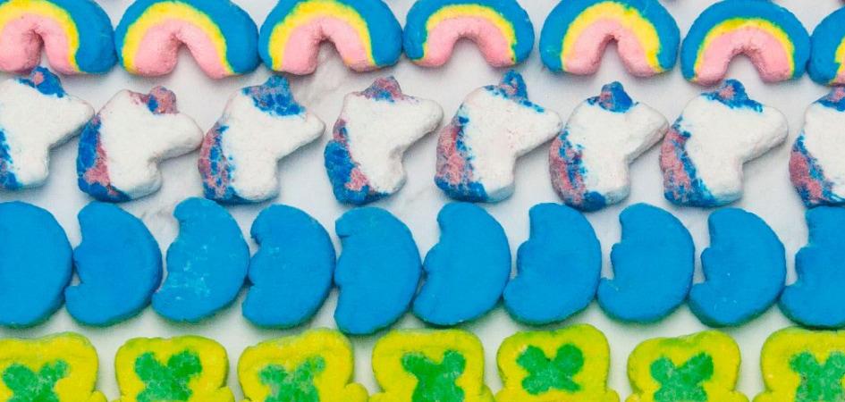 Rows of Lucky Charms marshmallow pieces on a white background