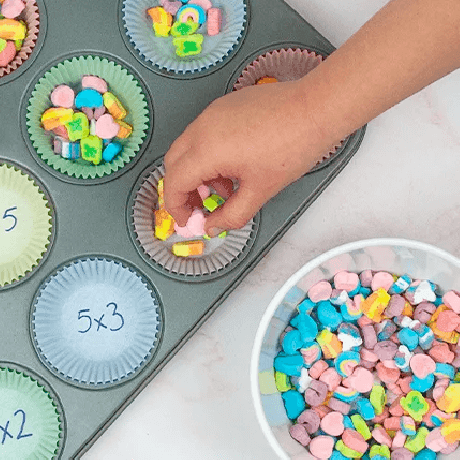 The muffin tin math activity in the midst of being done.